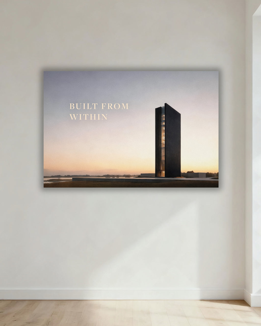 Statement Wandbild auf Alu-Dibond mit dem Statement "BUILT FROM WITHIN". Daneben ein dunkles und modernes Gebäude, das symbolisch für "BUILT" steht. Aufgehängt in einem Büro oder Homeoffice.