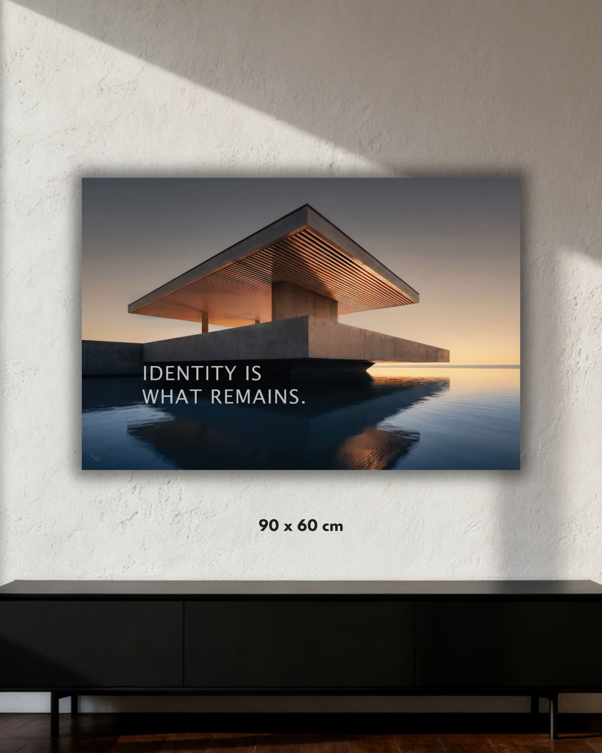 Statement Wandbild auf Alu-Dibond mit dem Statement "Identity is what remains." in der Größe 90x60 cm.